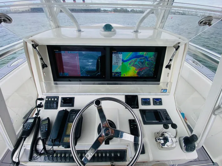 Part Time Hooker Yacht Photos Pics 2009 SeaVee IPS boat dashboard with dual navigation screens and control panel.