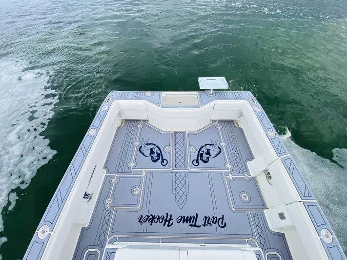 Part Time Hooker Yacht Photos Pics 2009 SeaVee IPS boat deck with custom design on open water.