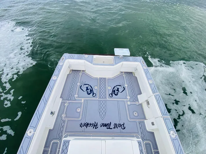 Part Time Hooker Yacht Photos Pics 2009 SeaVee IPS boat deck with custom design on open water.