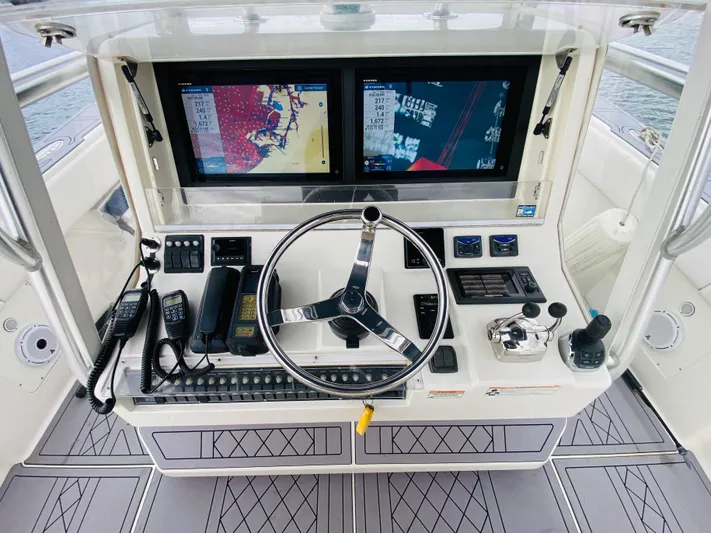 Part Time Hooker Yacht Photos Pics 2009 SeaVee IPS boat helm with dual navigation screens and modern controls.