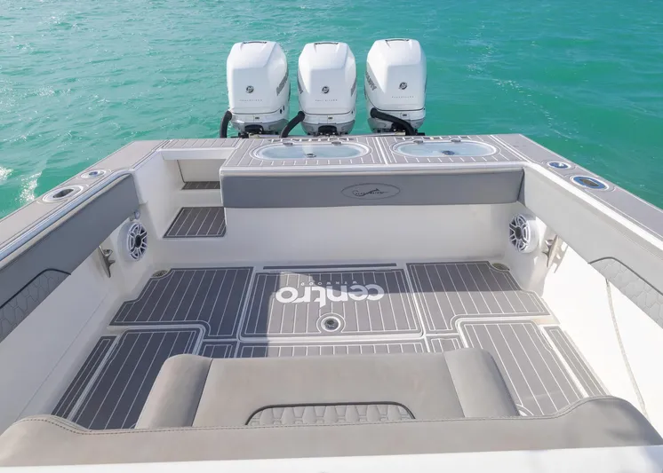  Yacht Photos Pics 2021 Blackwater 36 Sport boat with triple engines on turquoise water.