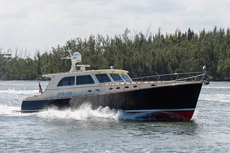 Holly Ann Yacht Photos Pics 2010 Vicem 58/64 yacht cruising on a river with forested background.