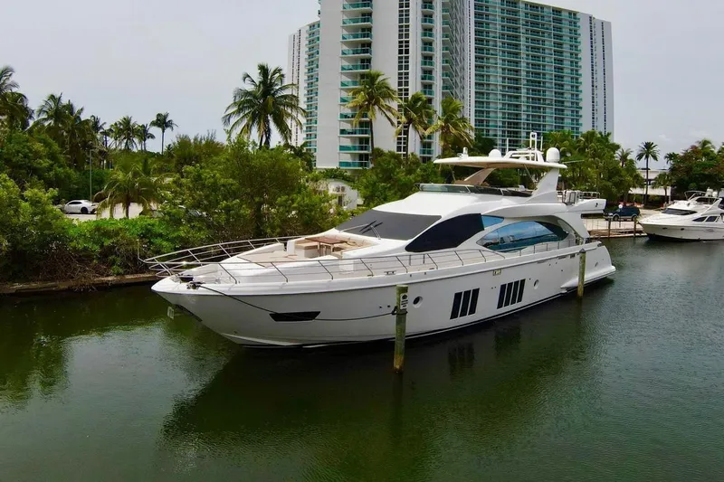  Yacht Photos Pics Luxurious 2015 Azimut 84 yacht docked near modern high-rise buildings.