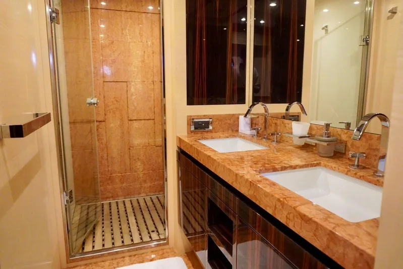  Yacht Photos Pics Luxurious bathroom in 2015 Azimut 84 yacht with dual sinks and glass shower.