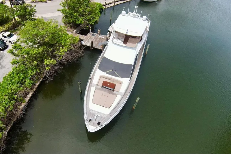  Yacht Photos Pics Aerial view of 2015 Azimut 84 yacht docked in a serene marina.