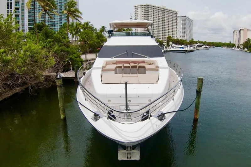  Yacht Photos Pics Luxurious 2015 Azimut 84 yacht docked in a scenic marina setting.