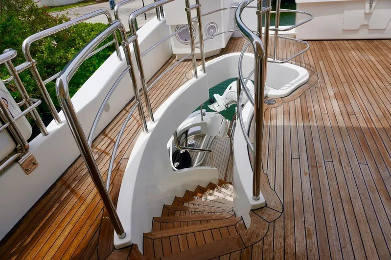  Yacht Photos Pics Luxurious 2015 Azimut 84 yacht deck with elegant wooden flooring and spiral staircase.