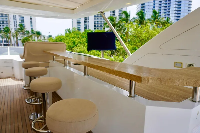  Yacht Photos Pics Luxurious 2015 Azimut 84 yacht deck with bar stools and scenic view.