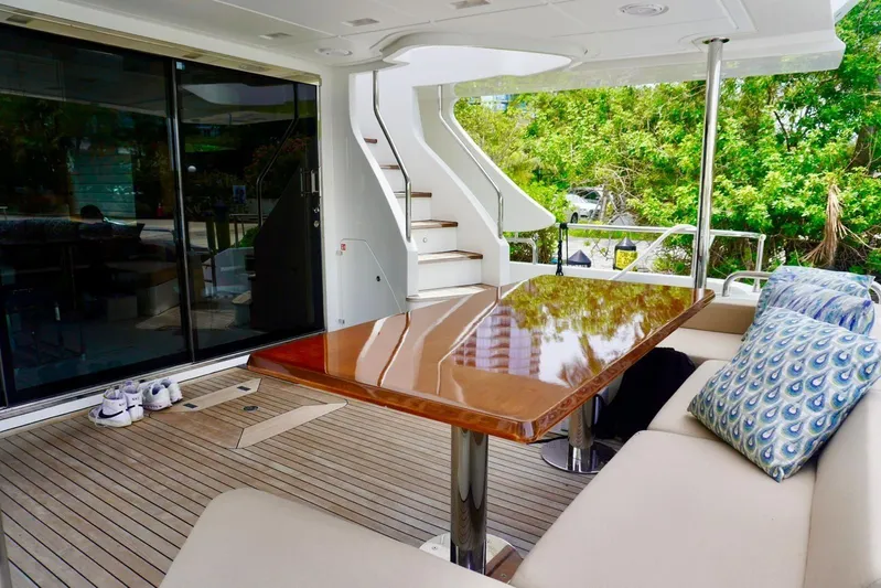  Yacht Photos Pics Luxurious 2015 Azimut 84 yacht deck with elegant seating and polished table.