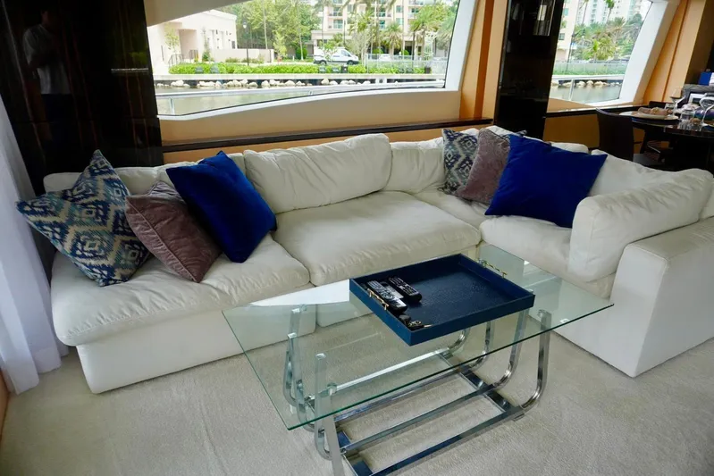  Yacht Photos Pics Luxurious interior of 2015 Azimut 84 yacht with plush white sofa and glass table.