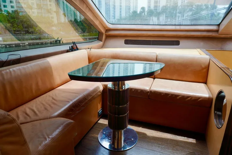  Yacht Photos Pics Luxurious interior of 2015 Azimut 84 yacht with leather seating and glass table.