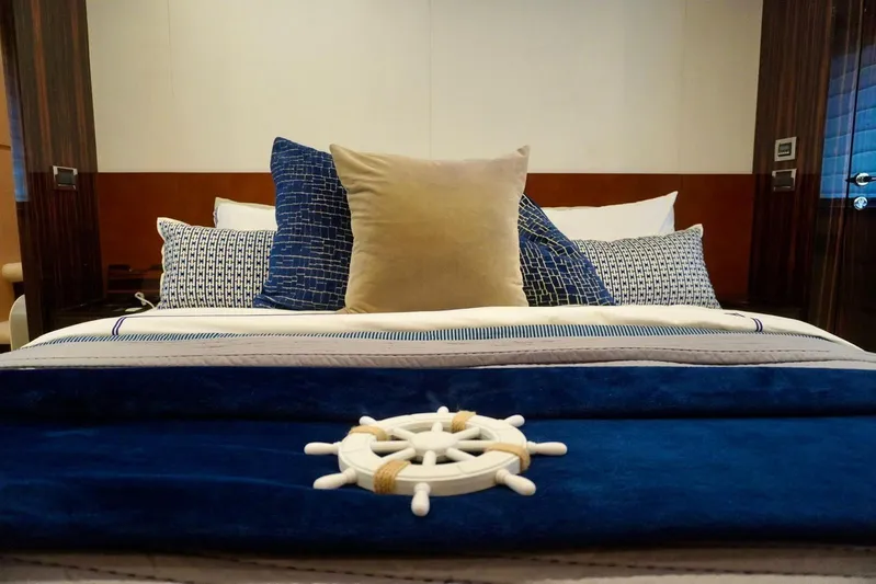  Yacht Photos Pics Luxurious bedroom interior on 2015 Azimut 84 yacht with nautical-themed decor.