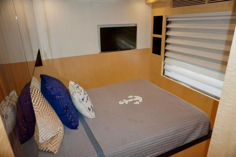  Yacht Photos Pics Luxurious bedroom interior of 2015 Azimut 84 yacht with modern decor and TV.