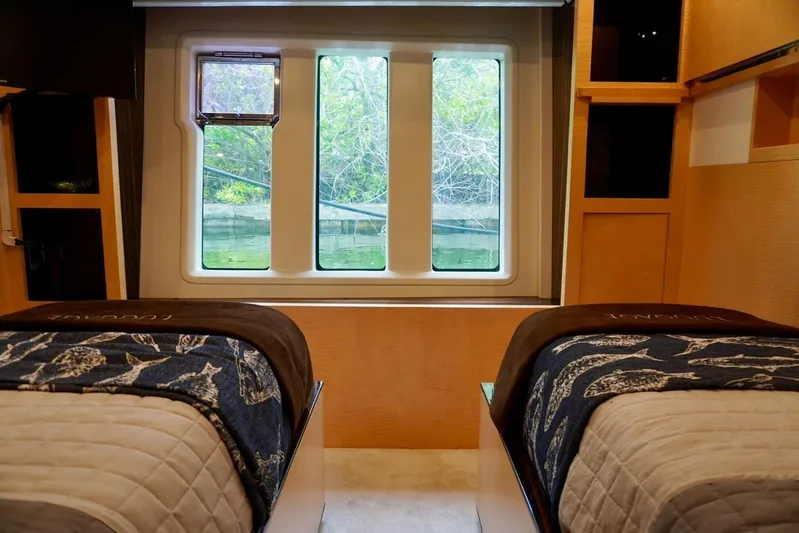  Yacht Photos Pics Luxurious 2015 Azimut 84 yacht cabin with twin beds and scenic window view.