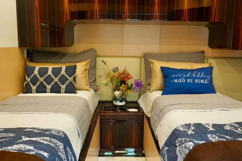  Yacht Photos Pics Luxurious twin bedroom on 2015 Azimut 84 yacht with elegant decor and floral arrangement.