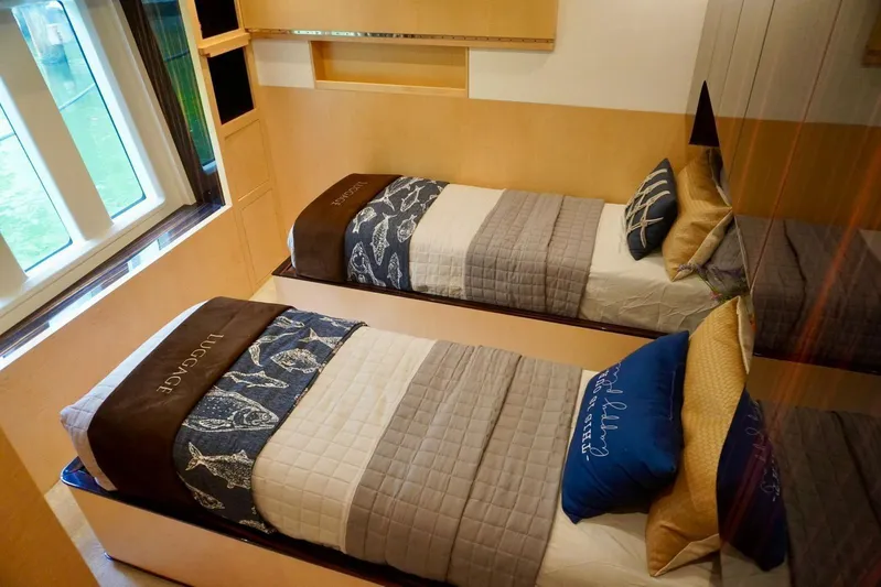  Yacht Photos Pics Luxurious twin bedroom in 2015 Azimut 84 yacht with elegant bedding and window view.