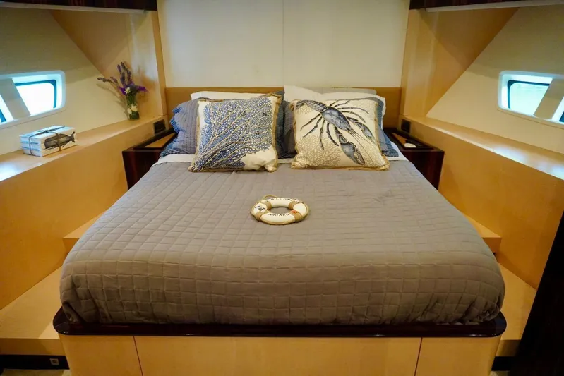  Yacht Photos Pics Luxurious bedroom interior of 2015 Azimut 84 yacht with nautical-themed decor.