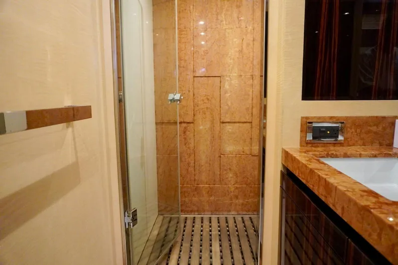  Yacht Photos Pics Luxurious bathroom interior on 2015 Azimut 84 yacht, featuring elegant wood and marble finishes.