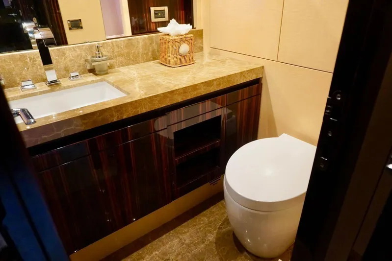  Yacht Photos Pics Luxurious bathroom in 2015 Azimut 84 yacht with marble countertop and modern fixtures.