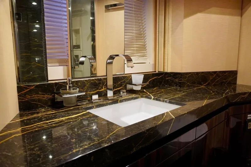  Yacht Photos Pics Luxurious bathroom sink with marble countertop in 2015 Azimut 84 yacht.
