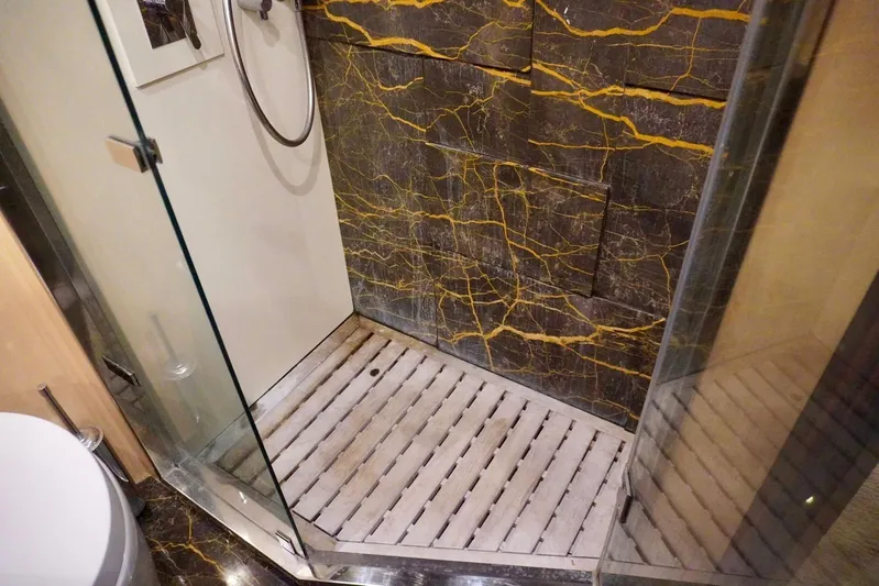  Yacht Photos Pics Luxurious shower with marble walls in 2015 Azimut 84 yacht bathroom.