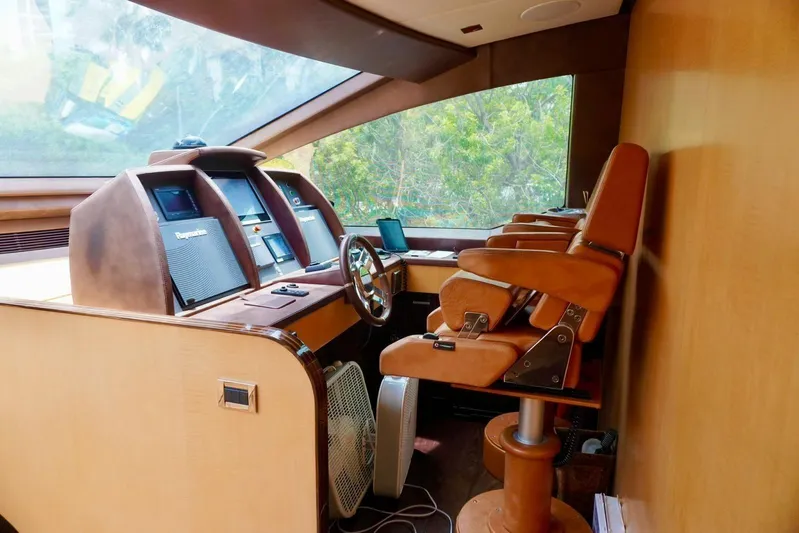  Yacht Photos Pics Luxurious helm of 2015 Azimut 84 yacht with leather seating and advanced navigation systems.