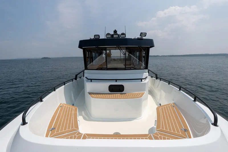Stock 2 Yacht Photos Pics 2025 Targa 32 GT boat on open water, featuring sleek design and spacious deck.