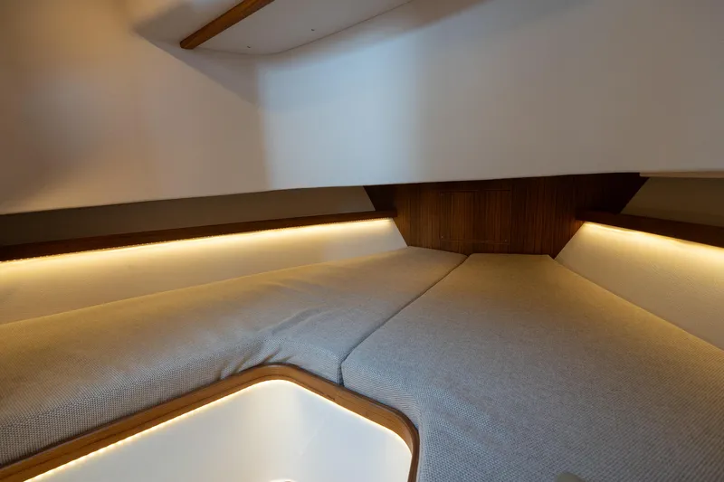 Stock 2 Yacht Photos Pics Interior cabin of 2025 Targa 32 GT boat with cozy lighting and modern design.