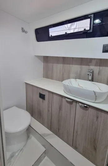 450 Rs Yacht Photos Pics Modern bathroom in 2026 Monachus 450 RS yacht with sleek sink and toilet.