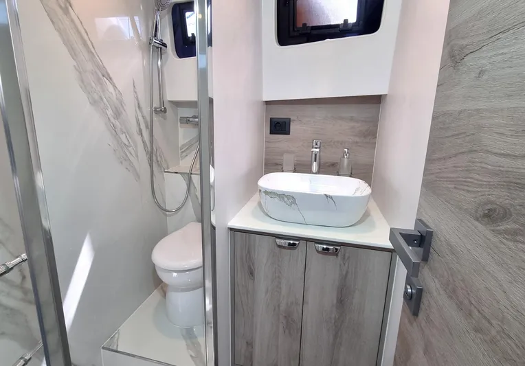 450 Rs Yacht Photos Pics Modern bathroom in 2026 Monachus 450 RS yacht with sleek fixtures and marble accents.