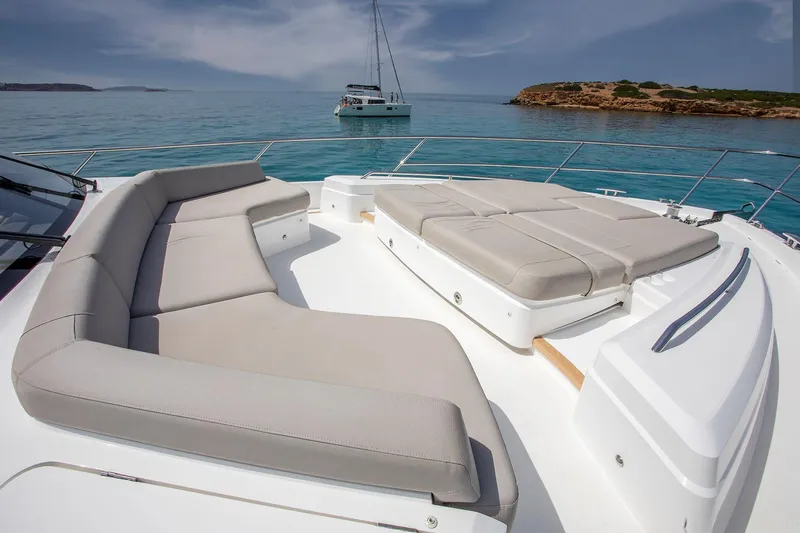  Yacht Photos Pics Luxurious 2020 Princess F70 yacht with spacious sunbathing area on calm sea.
