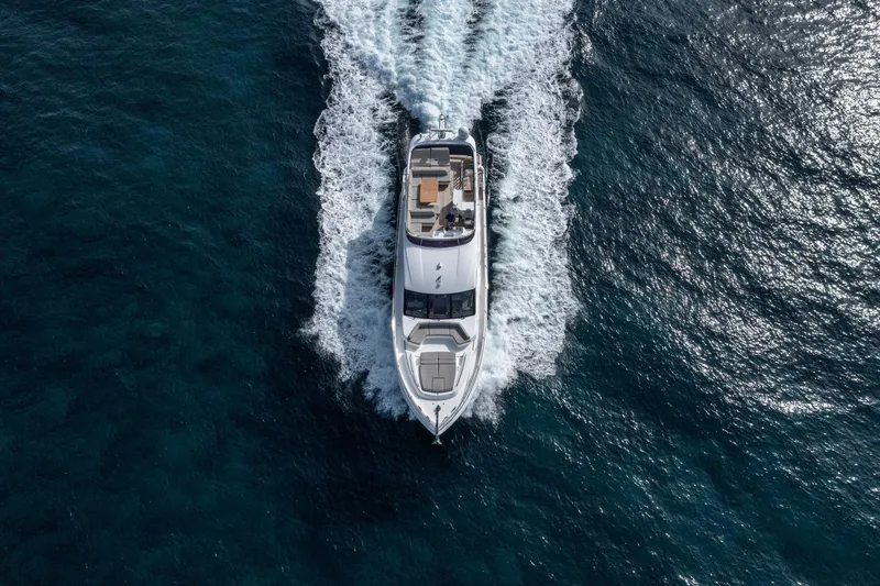  Yacht Photos Pics Aerial view of 2020 Princess F70 yacht cruising on open water.
