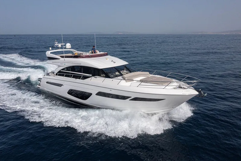  Yacht Photos Pics 2020 Princess F70 yacht cruising on open sea, showcasing sleek design and luxury features.