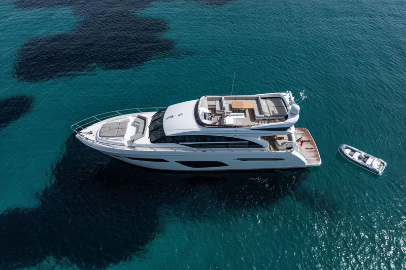  Yacht Photos Pics Aerial view of 2020 Princess F70 yacht on clear blue water.