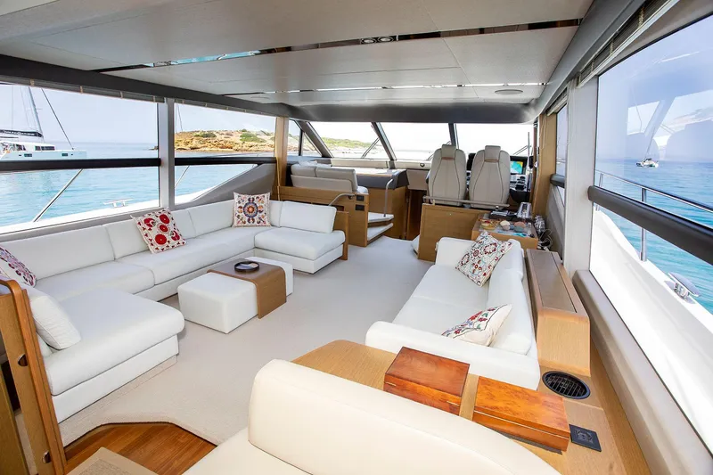  Yacht Photos Pics Luxurious interior of 2020 Princess F70 yacht with white seating and ocean view.