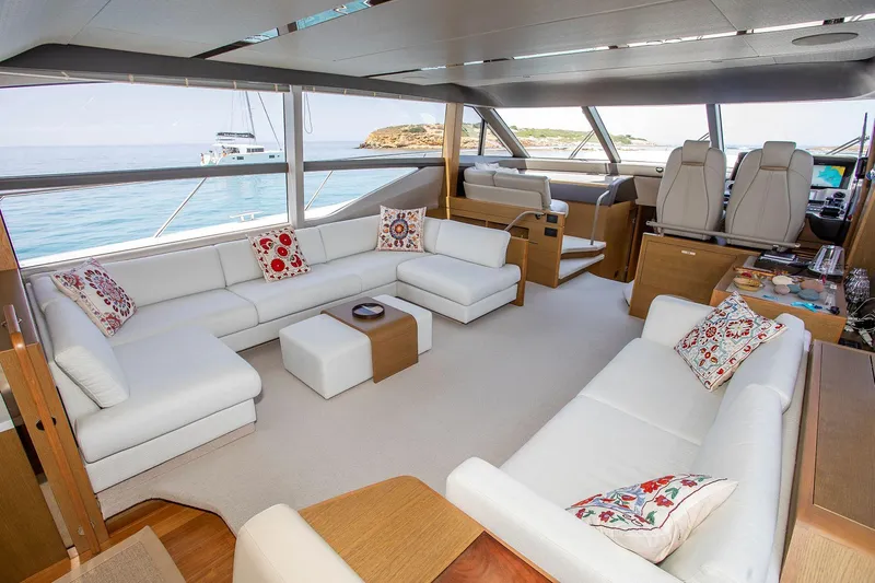  Yacht Photos Pics Luxurious interior of 2020 Princess F70 yacht with white seating and ocean view.