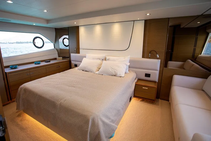  Yacht Photos Pics Luxurious bedroom interior of 2020 Princess F70 yacht with modern design and elegant furnishings.