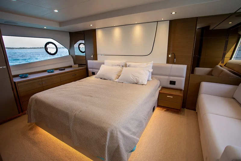  Yacht Photos Pics Luxurious bedroom interior of 2020 Princess F70 yacht with elegant design and ocean view.