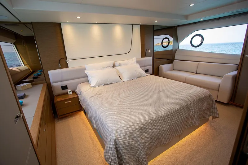  Yacht Photos Pics Luxurious 2020 Princess F70 yacht bedroom with modern decor and ocean view.