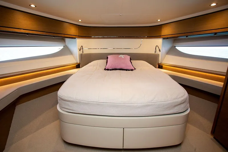  Yacht Photos Pics Luxurious bedroom interior of 2020 Princess F70 yacht with elegant lighting and modern design.