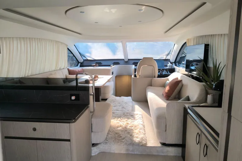  Yacht Photos Pics Luxurious interior of 2024 Azimut Fly 53 yacht with modern furnishings and panoramic windows.
