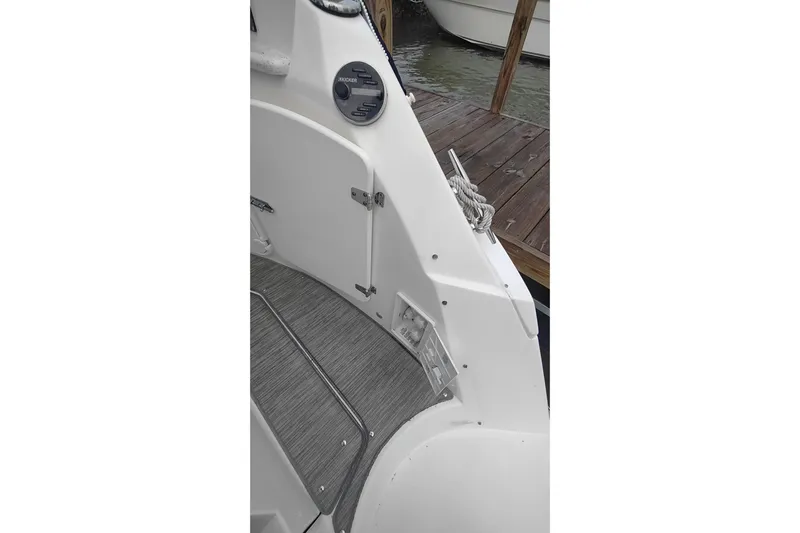 Yacht Photos Pics 2017 Rinker EX 320 boat interior with control panel and dock view.