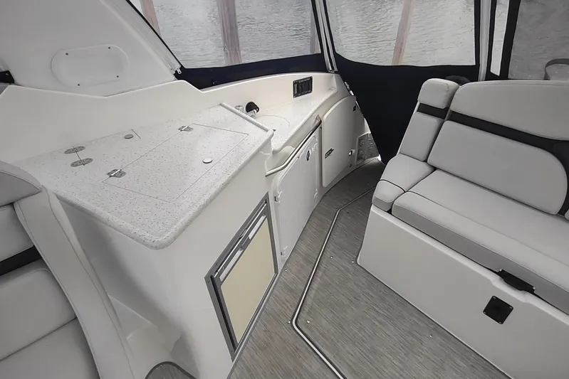  Yacht Photos Pics 2017 Rinker EX 320 boat interior with seating and kitchenette area.