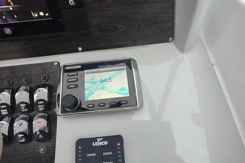  Yacht Photos Pics Control panel of a 2017 Rinker EX 320 boat with Kicker media center.