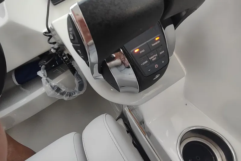  Yacht Photos Pics 2017 Rinker EX 320 boat throttle controls with illuminated buttons and cup holder.