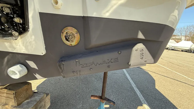 Scrimshaw III Yacht Photos Pics 2024 Jeanneau 895 Sport boat hull with trim tab and hardware.