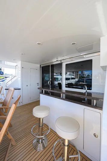 Claypen Yacht Photos Pics Luxurious 2013 Ocean Alexander Sky Lounge yacht with sleek bar and seating area.