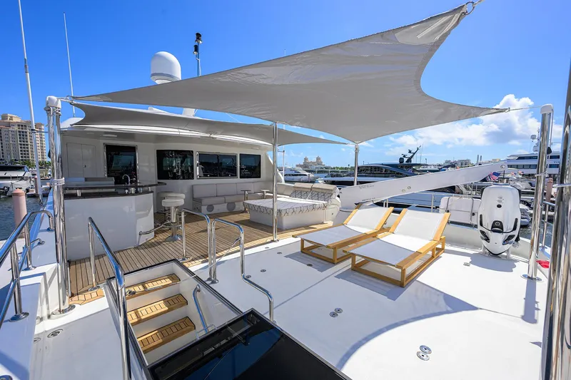 Claypen Yacht Photos Pics Luxurious 2013 Ocean Alexander Sky Lounge yacht deck with sun loungers and shaded seating area.