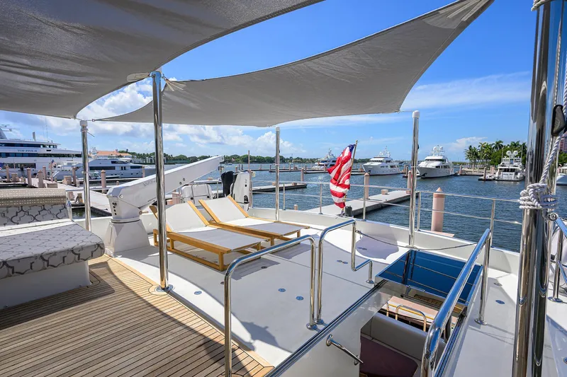 Claypen Yacht Photos Pics Luxurious 2013 Ocean Alexander Sky Lounge yacht with sun loungers and marina view.