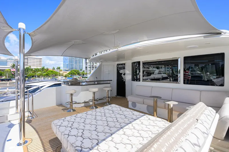 Claypen Yacht Photos Pics Luxurious 2013 Ocean Alexander Sky Lounge yacht with spacious deck, bar stools, and elegant seating.